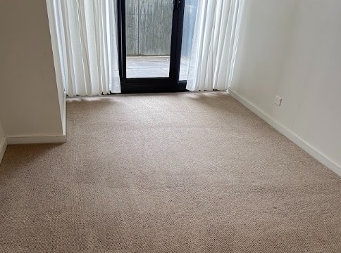 Freshly cleaned bedroom carpet with no stains or marks, ready for final inspection